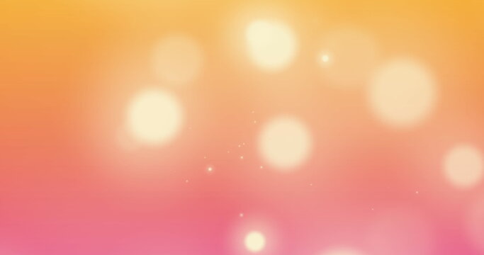 Image of spots of light against orange and pink gradient background with copy space