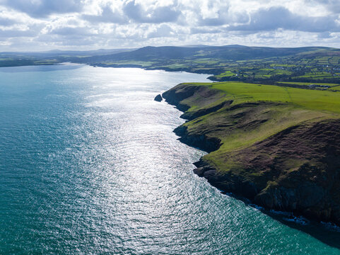 Aerial shot of Ynys Dinas headland and coastline, looking towards Newport, Pembrokeshire, West Wales