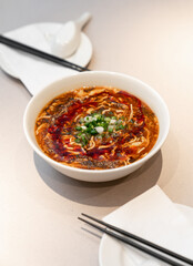 Chinese spicy mala noodle soup. Table meal in restaurant.
