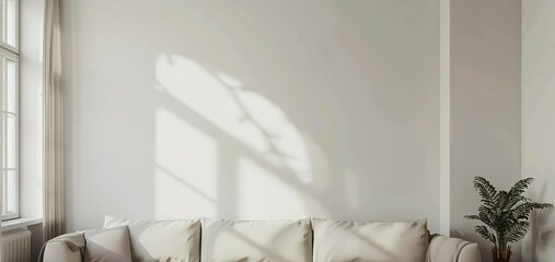 A living room view with a couch, white wall, empty wall, for a artwork mockup display no frame on the wall