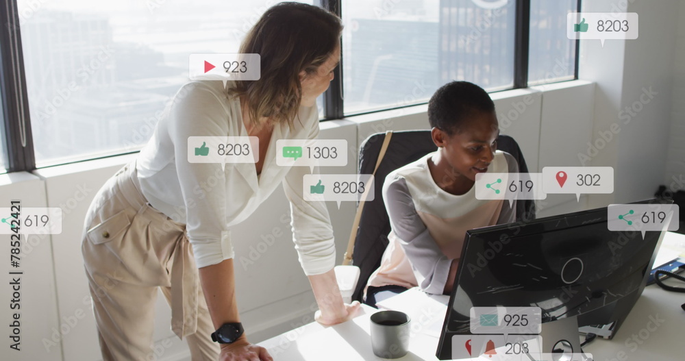 Poster image of multiple notification bars over diverse female coworkers discussing reports on computer