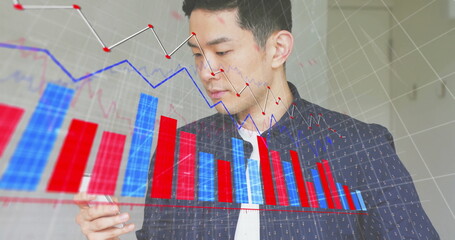 Image of financial data processing over caucasian businessman using smartphone