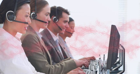 Image of network of connections over happy diverse office workers wearing headsets