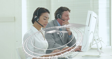 Image of network of connections over diverse office workers wearing headsets