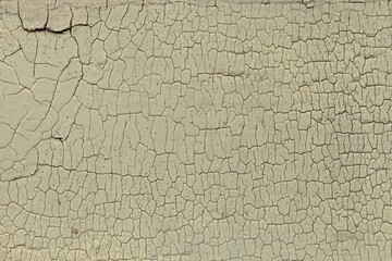 Abstract closeup surface view of old paint cracked on a wall.