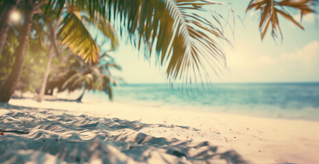 Beautiful exotic blurred seaside view with tropical palms and sand, summer vacation and travel concept.