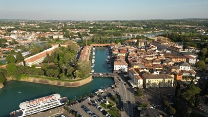 Aerial view of the city of Peschiera del Garda, Verona, Veneto. View of Canale di Mezzo in Italian...