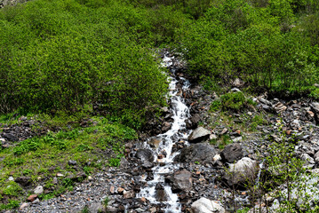 Beautiful panoramic view of Midagrabin waterfalls in summer, North Ossetia, Russia.