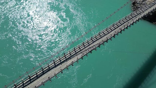 Aerial Overhead View Of Kowardo Suspension Bridge Over The Indus River In Skardu