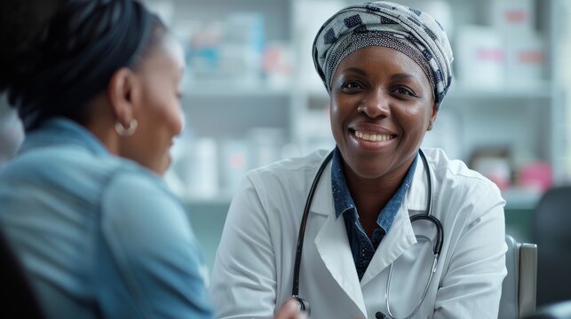Caring female oncologist discussing treatment options with patient in clinic