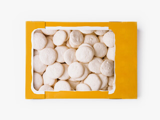 Box of fresh meringues on white background