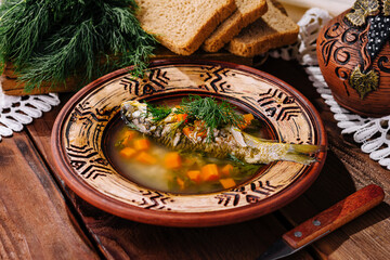 Traditional fish soup in rustic setting