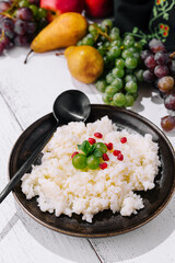 Homemade creamy rice pudding with fresh pomegranate seeds