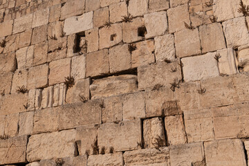 The layered stones of the Western Wall in the Old City of Jerusalem, Israel.