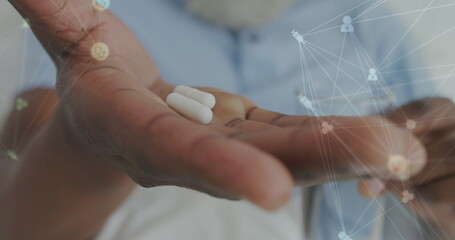 Image of data processing over senior african american man with pills - Powered by Adobe