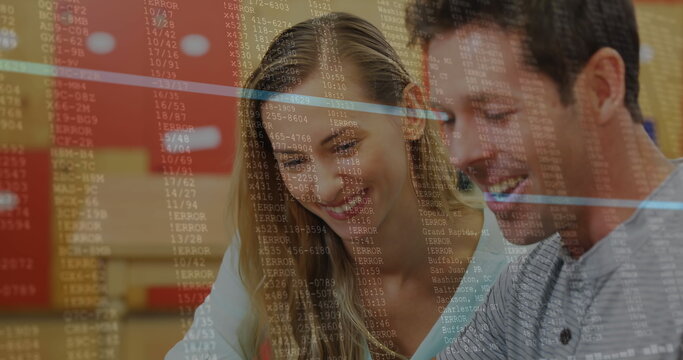 Image of data processing against caucasian couple smiling while using digital tablet