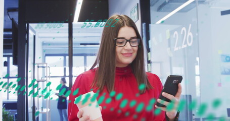 Image of data processing over caucasian businesswoman with smartphone