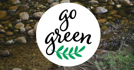 Image of go green text over river and rocks