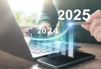 2025 new year. Business plan 2025 new year. Man working on laptop with growth chart 2025. Start new year 2025 with goal plan, goal concept, action plan, strategy, new year business vision.