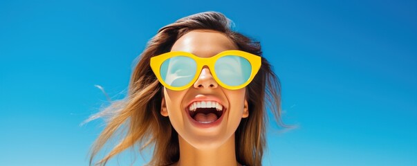 Photo of A woman holding up an empty frame with space for text on white background, excited expression, wearing sunglasses and yellow dress.  - obrazy, fototapety, plakaty