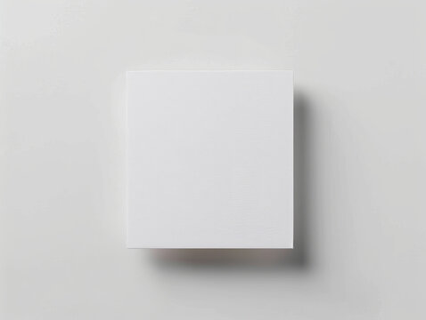 Top view of a white square paper on the white ad for mock up