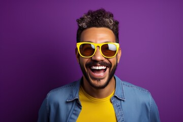 Photo of A woman holding up an empty frame with space for text on violet background, excited expression, wearing sunglasses and yellow dress - obrazy, fototapety, plakaty