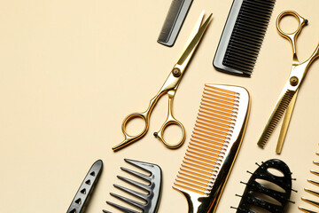 Hairdressing tools on beige background, flat lay. Space for text - obrazy, fototapety, plakaty