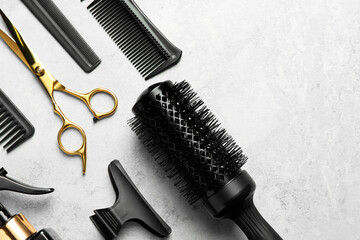 Hairdressing tools on light background, flat lay. Space for text