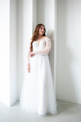 Fototapeta premium young beautiful woman bride in wedding dress