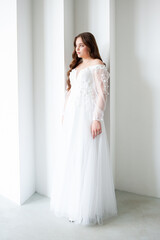Fototapeta premium young beautiful woman bride in wedding dress