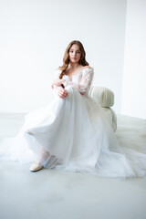 Fototapeta na wymiar young beautiful woman bride in wedding dress
