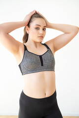 Obraz premium woman in sportswear doing fitness at home