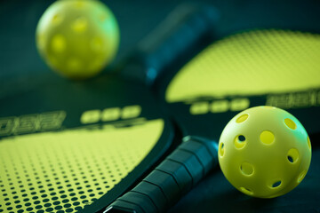 Pickleball game set. Rackets and balls on the court. Copy space. Sports background. - 785283653