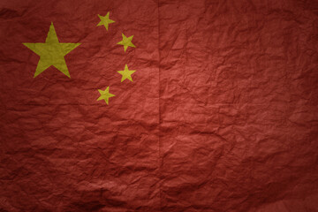 big national flag of china on a grunge old paper texture background