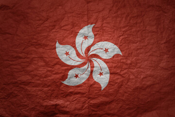 big national flag of hong kong on a grunge old paper texture background