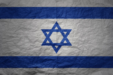 big national flag of israel on a grunge old paper texture background