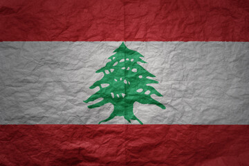 big national flag of lebanon on a grunge old paper texture background