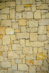texture of a house wall made of real wild stone