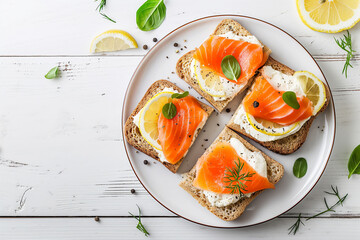 Sandwiches with cream cheese, salmon and parsley on a white wooden background, Top view