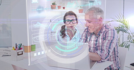 Image of data processing over caucasian male ad female fashion designers discussing at office