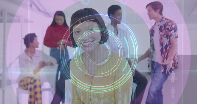 Image of neon light trails and round scanner over asian woman using digital tablet at office