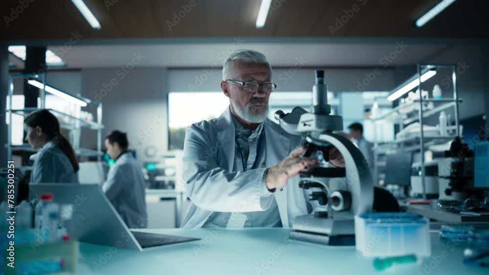 Poster senior medical research scientist looking at biological samples under a microscope in an applied sci