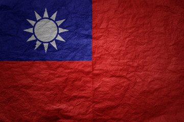 big national flag of taiwan on a grunge old paper texture background