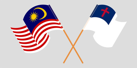 Crossed and waving flags of Malaysia and christianity