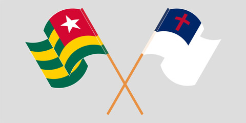 Crossed and waving flags of Togo and christianity