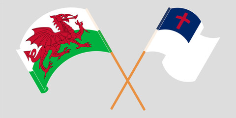 Crossed and waving flags of Wales and christianity