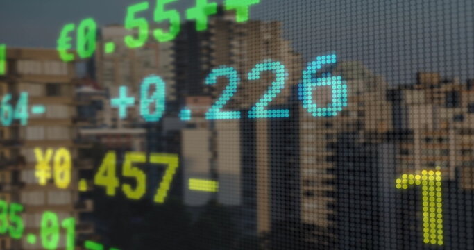 Image of stock market over cityscape