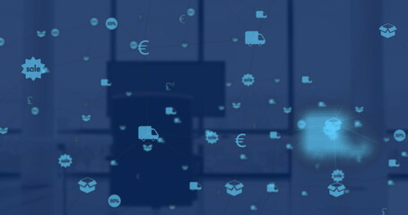 Image of web of connections with icons floating over a desk with desktop computer
