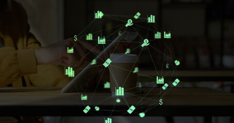Image of web of connections with icons floating overa a woman using a digital tablet