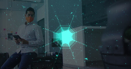 Globe of network of connections against man wearing face mask using digital tablet at office